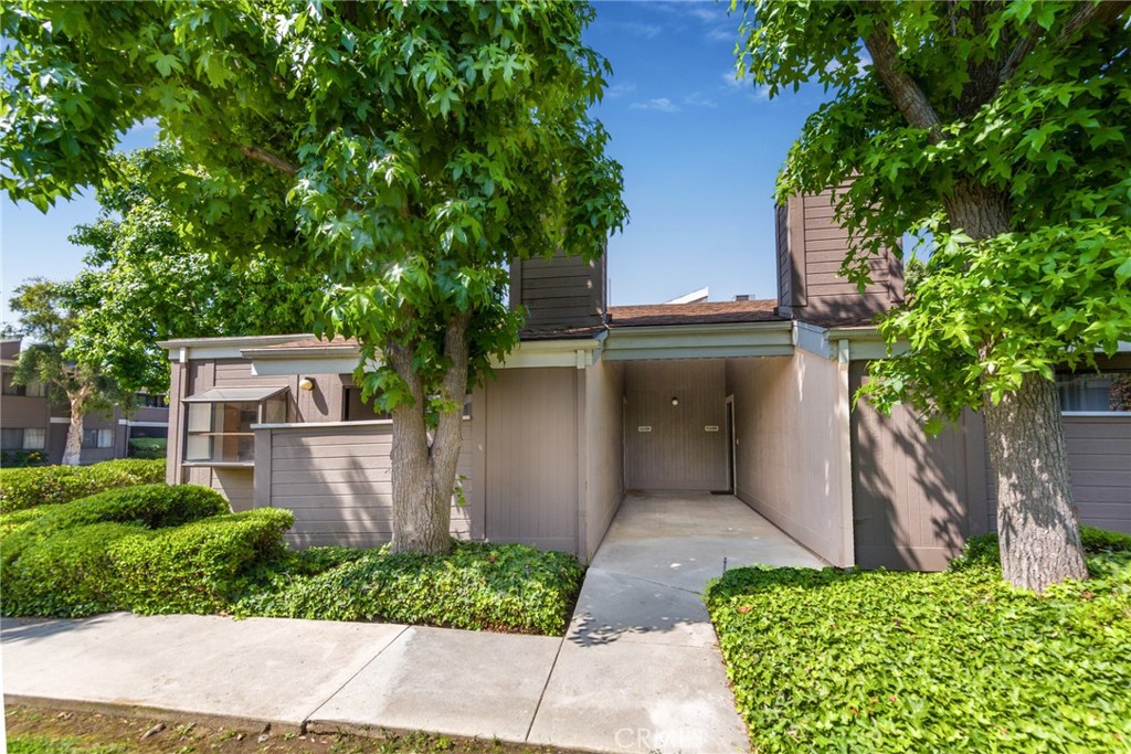Beautiful single-story condo with NEW laminate wood flooring is move-in ready. Located in the peaceful Hartland Village complex that offers beautiful greenbelts, gated community pool and plenty of guest parking. Amazing privacy with end unit location with no upstairs unit. Living room features brick fireplace, vaulted ceilings and with lots of natural light. Spacious bedroom with walk in closet. Newer AC Unit. Laundry inside the unit and Private 2 car detached garage with high ceiling for extra storage. Garage is located in front of the unit for easy access. All appliances included.