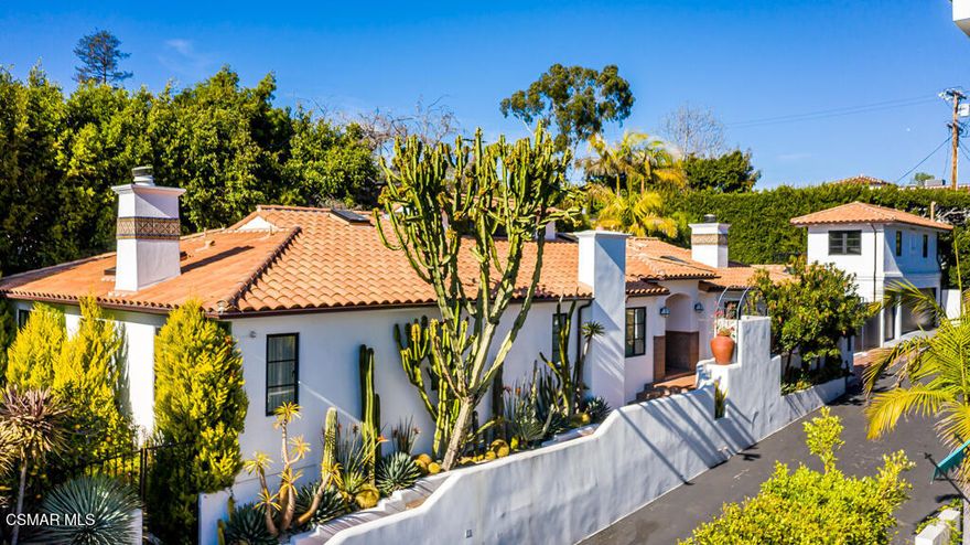 Retreat into this one story Hacienda style ranch home where privacy and romantic escape are the motif. The definition of move-in ready. Owners took this place down to the studs to rebuild into a vision of jazz age Hollywood luxury with high tech modern convenience. Euroline windows, one-of-a-kind ceramic hand painted tile details, restored original fireplaces, and bespoke lighting, and a zoned wireless sound system, are some of the details that go above and beyond high-end. The Main home has 4 bedrooms ( 4th bedroom is currently an office) and 4 full bathrooms. The owner's suite has a custom walk-in closet with a rolling ladder and an en-suite bathroom. Appliances and fixtures are all installed in 2018 new. When owners restored the home they replaced all the plumbing, electrical, and put in a new sewer line; two tankless water heaters; two  new AC units and newer roof. Kitchen was built with entertaining family in mind. High end brand new appliances, with vintage feel and copper finishes. Sweeping marble counters and well appointed storage with custom cabinetry. Above the two car garage is a studio with an added full bathroom. Perfect for guests, office or music studio. The entire property is protected by a state of the art security system, with a custom rolling fence between the driveway and patio entrance. Pool and hot tub area is Ideal for outdoor entertaining, right off the living room with a butler's pantry and wine fridge. Landscaped to capture the calm of a desert paradise with palms, citrus, and succulents. Extremely low maintenance home, ready when you are, and always secure. Main house is 3125 and apartment above garage is 500 aprox -including full bathroom.