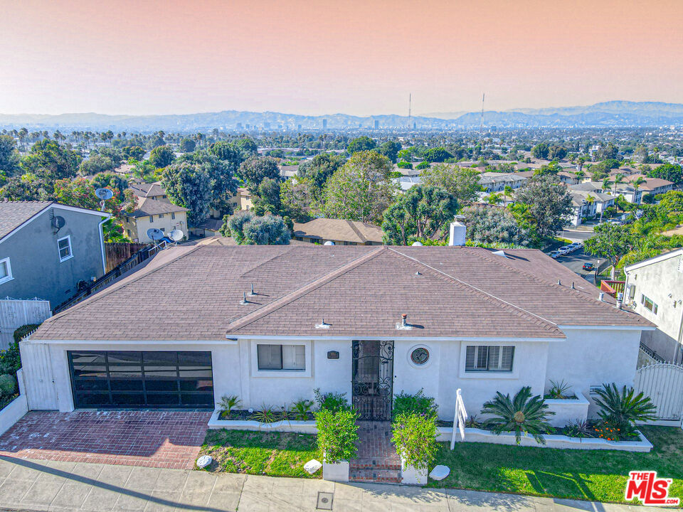 Beautiful Home with a Spectaular View from Century City from the west to Downtown, mountains and beyond from the east and the Hollywood sign from the north!! Light ,airy and bright with views from every room .Updated kitchen with new appliances and flooring and updated bathrooms. livingroom with fireplace. Hardwood floors throughout the home and lots of windows to capture the VIEWS. Also have a Master Suite, like being on vacation everyday! Huge expansive deck for outdoor living and entertaining, all on an over 8,000 sf lot.