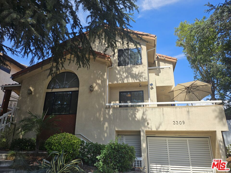 This beautifully maintained end unit townhouse offers exceptional privacy, timeless style, and an unbeatable location within the highly sought after La Crescenta school district, perfectly situated near Crescenta Valley Park, shopping, dining, and convenient freeway access, this residence seamlessly blends comfort and convenience. Featuring three bedrooms and three bathrooms within a thoughtfully designed tri level layout, the home welcomes you with abundant natural light, a cozy fireplace, and an effortless flow into the dining area, while a private patio extends the living space and provides an ideal setting for relaxing or entertaining guests. The upgraded kitchen includes countertops, stainless steel appliances, and a bright breakfast nook framed by a charming garden window, and upstairs all bedrooms are light filled and inviting. The primary suite includes a spacious closet, a private balcony, and a well appointed bathroom. Additional highlights include a skylight in the hallway, in unit laundry, upgraded wood flooring, plush carpet in the bedrooms, and dual pane windows for improved energy efficiency and noise reduction, while recent system upgrades including a brand new HVAC (2025) and a new water heater (2025) provide added peace of mind. Two car garage includes a separate storage room. Lovingly maintained and move in ready, this residence is prepared for its next owner to enjoy.