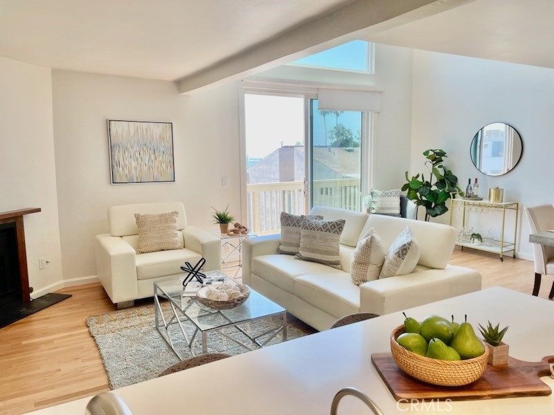 Spectacular Ocean View Townhome in the Heart of Playa del Rey Village! This stunning 2-bedroom, 2.5-bath townhome with a loft offers 1,763 sq ft of tastefully remodeled living space and sweeping ocean views. The sun-drenched living room features soaring ceilings, a cozy fireplace, a private balcony, and picturesque views of the park, beach, and ocean. The open-concept kitchen, seamlessly connected to the living area, has been elegantly updated with quartz countertops, new cabinetry, and a breakfast bar—perfect for casual dining. Upstairs, the loft can serve as a home office or a cozy sleeping nook—the owners have even hosted guests there—and it also enjoys beautiful ocean views. Just off the loft is a private rooftop patio, ideal for sunbathing or relaxing with your favorite drink while embracing the coastal lifestyle. Enjoy three separate outdoor spaces with ocean views. The kitchen-level balcony, where the owner previously had a grill, also overlooks the ocean. This home is located just one block from a park featuring a brand-new children’s playground. The spacious primary suite includes a walk-in closet and a private balcony with ocean views. The remodeled en-suite bathroom features a walk-in shower and dual sinks for added comfort and convenience. Additional highlights include a remodeled guest bathroom, engineered white oak floors, dual-pane windows, in-unit laundry, side-by-side parking, and extra storage in the garage. Ideally situated just steps from the beach, a neighborhood park, the lagoon, and a vibrant mix of local restaurants, cafes, and shops—this home offers the ultimate in coastal living. Don’t miss the opportunity to own this exceptional property in one of the most desirable beach communities in Los Angeles. A unique location that blends walkable access to the beach, wetlands, and dining. Schedule your private showing today!
