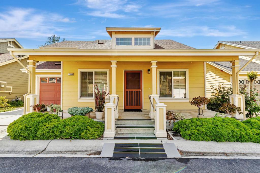 This beautifully maintained 3 BD/2BA home offering 1,293 sq. ft. of thoughtfully designed living space is nestled in Gilroy's sought-after gated senior community, Village Green. The bright & airy great room features vaulted ceilings & abundant natural light, creating an inviting atmosphere for relaxation &entertaining. The kitchen boasts granite countertops & is equipped w/ essential appliances, including a refrigerator, oven range, & dishwasher, catering to all your culinary needs. The homes layout includes a convenient ground-floor primary bedroom & bathroom. The upstairs bedrooms are accessible via a chair lift, enhancing mobility & ease of access. Bathrooms are thoughtfully designed w/handrails for added safety. Additional features include mirrored closet doors, a security screen door, & built-in storage in the garage. The in-garage laundry area comes complete w/ a washer & dryer, which stay with the home. Enjoy the west-facing patio that offers plenty of sunlight, perfect for outdoor relaxation. Village Green provides an array of amenities tailored for active seniors, including a pool, gym, recreation room, & beautifully landscaped parks w/ tranquil fountains and benches. The community's serene environment & well-maintained facilities make it an ideal place to call home.