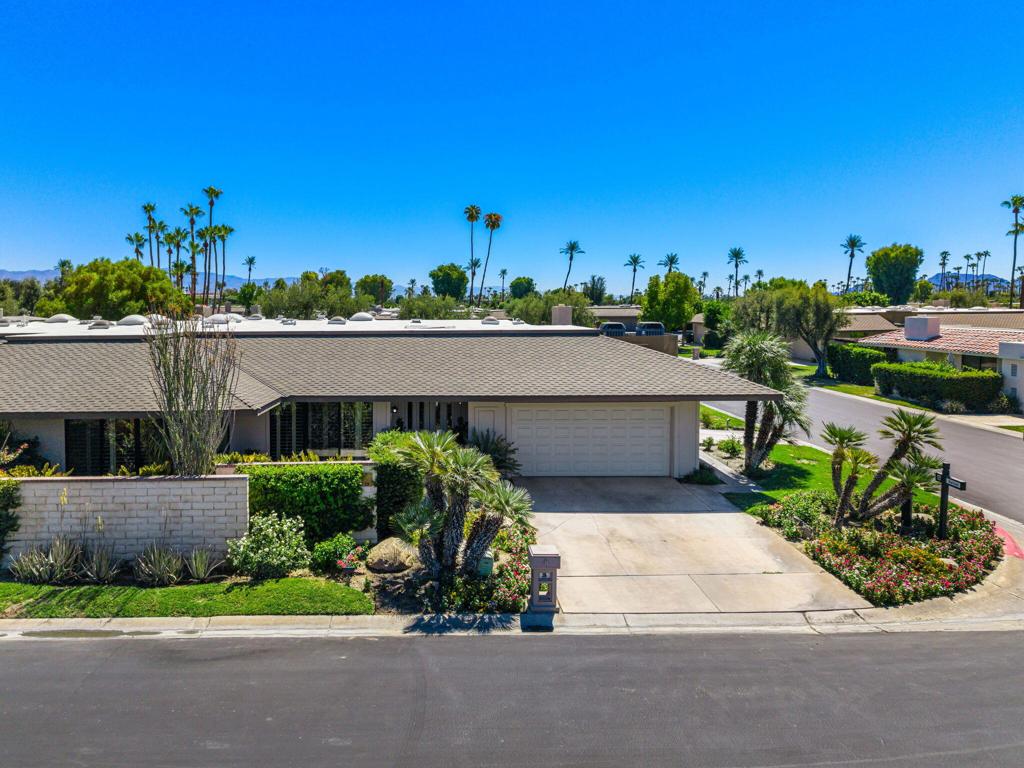 This beautiful extended Broadmoor plan offers 3 spacious bedrooms each with en suite bathrooms designed for both comfort and privacy. The heart of the home is a remodeled kitchen and an extended family room making it the perfect space for everyday living or entertaining. Designed with refined desert living in mind, this home has been upgraded with Milgard double-paned, bronze anodized, thermal break aluminum windows and doors, bringing in abundant natural light while offering superior energy efficiency and durability along with an AC unit in the garage for ultimate comfortability. Step outside to your private patio, surrounded by vibrant landscaping, an inviting space for quiet mornings. Set within the prestigious The Springs Country Club in the heart of Rancho Mirage, this home offers more than a residence, it offers a lifestyle. The Springs boasts world-class amenities, including golf, tennis, pickleball, fitness center, a vibrant social community, and more. Whether you're seeking relaxation, recreation, or connection, The Springs delivers it all.