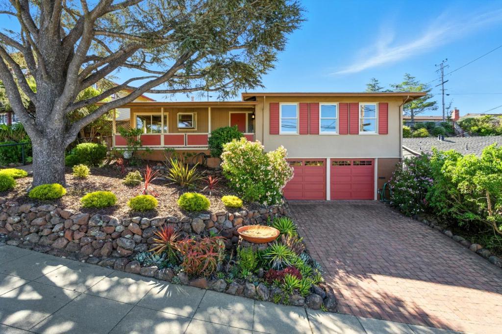 This truly charming three bedroom, two bath home has been lovingly cared for and updated both inside and out! Large picture windows fill this special home with natural light; gleaming hardwood floors add to the warmth and appeal. The chef's kitchen features newer appliances, plenty of storage and counterspace and a garden window overlooking the lovely front landscaping. The breakfast nook features built-in cabinetry and a picture window framing views of the nearby hills. The combined living room and dining room center around an elegant fireplace. The inviting family room opens to the outdoor dining area ideal for that quintessential indoor/outdoor California lifestyle. The primary suite with ample closet space, and large windows overlooking the front yard. The two nicely-sized guest rooms are perfect for the kids, guests or as a work-from-home offices. The backyard oasis is extremely private and features both sun and shade. The incredible landscaping features year-round color, fruit trees and a tranquil water feature with multi-leveled patios. The oversized 2-car garage has storage space and a workbench. This sought-after neighborhood is just a short stroll to the Carlmont Village restaurants and shops. Close to top-rated schools, parks and major streamlined commute routes.
