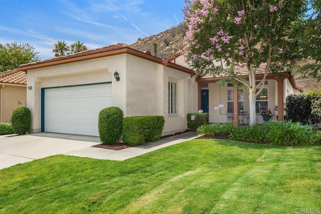 Welcome to this wonderful single story home located in the highly sought after gated, golf course community in Rancho San Pasqual. This home offers an open floor plan with plenty of natural light, 2 bedrooms, an office with French doors and 2 bathrooms. Fresh, new and neutral interior paint throughout the home. New carpet in Family room and Primary bedroom. This home backs to open space with beautiful mountain views. a large stamped concrete patio and a low maintenance yard. This secret gem of a community is cherished by all who reside here. The community park and playground includes a basketball court, pickle ball court, Olympic size pool heated year round, spa, clubhouse and BBQ area. Summer movies in the park are always a hit and Dos Osos golf course recently purchased, improved and now managed by JC Resorts has become another common area for families to enjoy live music, pizza nights and fun activities on the beautiful deck while relaxing amongst the beautiful hills in the valley. Conveniently located near wineries, shopping and the World Famous Safari Park also within walking distance to the award winning K-8 San Pasqual Union School, the little school in the valley. Come see this wonderful home and all it has to offer.