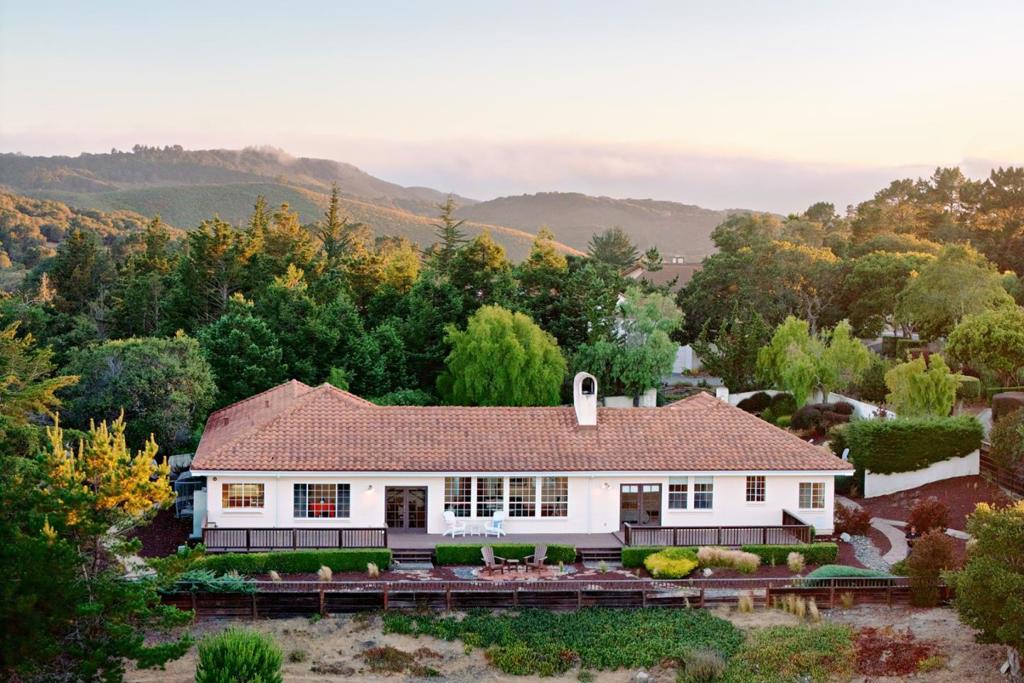 If expansive mountain and valley views, over 1 acre of private usable land, and 3,000+ SqFt of single-level living sound appealing, look no further than 10590 Hidden Mesa. Thoughtfully maintained and recently re-roofed, this home welcomes you through a gated courtyard with a newly installed putting green. You are welcomed into a spacious great room with incredible views of the Monterey-Salinas corridor and the multiple mountain ridgelines beyond. The 3 bedroom, 3 bath home is perfect for efficient, comfortable living, and the office/den could easily be converted to a fourth bedroom. The kitchen, dining area, and living room are all incorporated into one great space that enjoys the views to the east and leads out to a large deck running along the entire back side of the house, showcasing the views from Fremont Peak to Mount Toro. A large 3-car garage fronts a generous circular driveway with abundant parking and sunlit grounds. Just a short drive from all the wonderful outdoor activities, shops, and restaurants provided by the Monterey Peninsula, your Monterey Paradise awaits.