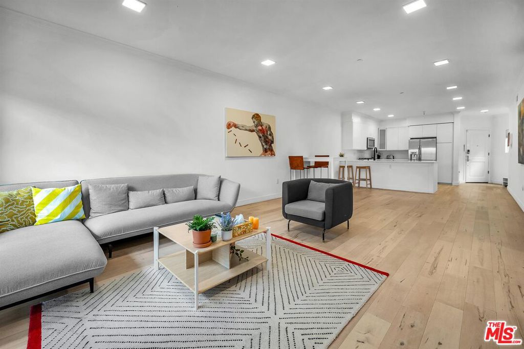 This sophisticated condominium located in the bustling Koreatown neighborhood of Los Angeles. This 2-bedroom, 2-bathroom residence spans approximately 1,310 sq ft and was built in 2007, showcasing modern architectural design and an open-concept floor plan. The home boasts high-end finishes, a spacious living area filled with natural light, and a sleek, well-equipped kitchen featuring premium appliances and contemporary cabinetry. The primary bedroom offers a private ensuite bathroom with stylish fixtures and ample closet space, while the second bedroom provides versatility for guests or a home office.This property is part of a meticulously maintained complex that ensures residents' comfort and security. Amenities include secure assigned parking, an elevator for easy access, and well-kept common areas. Its location is unbeatable, positioned in the heart of Koreatown, where residents can enjoy a vibrant urban lifestyle. Within walking distance are some of Los Angeles' best dining options, cafes, entertainment venues, and cultural attractions, along with convenient access to public transportation and major freeways.