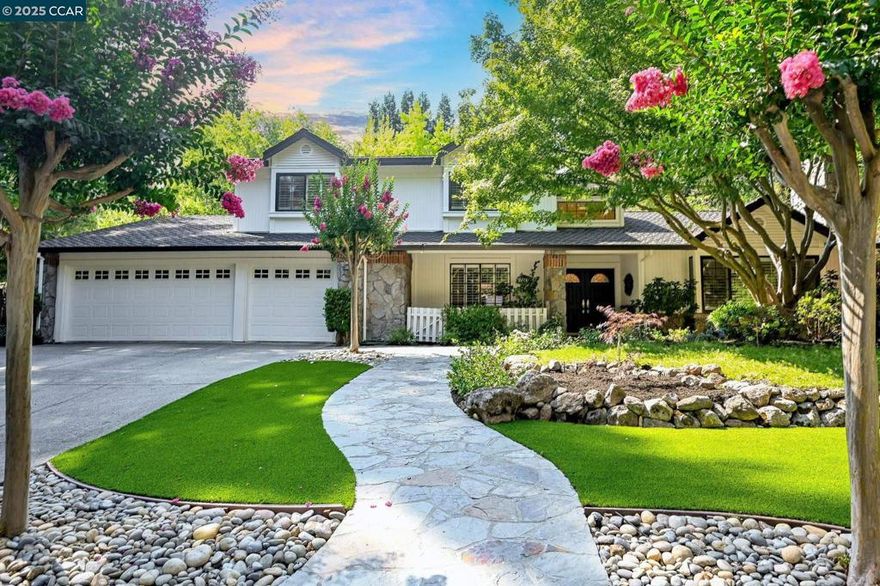 Fantastic home and a FANTASTIC NEW PRICE! Tucked behind the gates of the coveted Hidden Oaks community, this timeless estate blends classic design with resort-style living. Soaring vaulted ceilings and an abundance of natural light create a warm and inviting ambiance throughout. The thoughtfully designed floor plan features a main-level primary suite with French doors opening to the backyard, a luxurious spa-inspired bath with soaking tub and shower, walk-in closet with custom built-ins, and a private laundry area. A secondary downstairs bedroom—currently used as an executive office—includes a built-in Murphy bed and easy access to the guest bath, offering exceptional flexibility for guests or remote work. Upstairs, three additional bedrooms include one with an en-suite bath, plus a full hall bath and dedicated laundry room. Step outside to your private oasis with a resort-style pool and spa, sport court, and lush grounds designed for effortless indoor-outdoor living. The expansive backyard also offers space for a potential pool house or ADU, adding even more value and versatility.