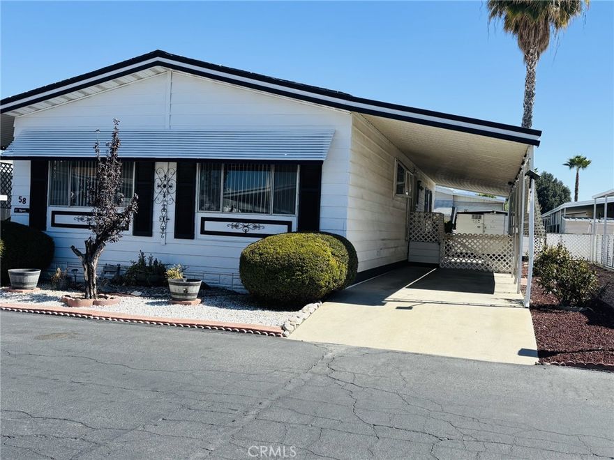 WELCOME TO 55+ COMMUNITY!!! COME VIEW THIS 2BEDROOM 2FULL BATHROOM WITH OPEN FLOOR PLAN... Has a very cozy feel with an awesome chimney in the family room. Kitchen offers open area for entertaining family and friends, holidays are around the corner plenty of room to enjoy company. Property has parking for two cars on the side with Carport Cover. Shed in the backyard is a great size to storage almost anytime. Front entrance has very nice brick steps with black rail to the front main door with a security metal door. As a bonus area there's a workshop or den with a door going to the backyard... The yard has beautiful trees and plenty space in the backyard to add more fruit trees.