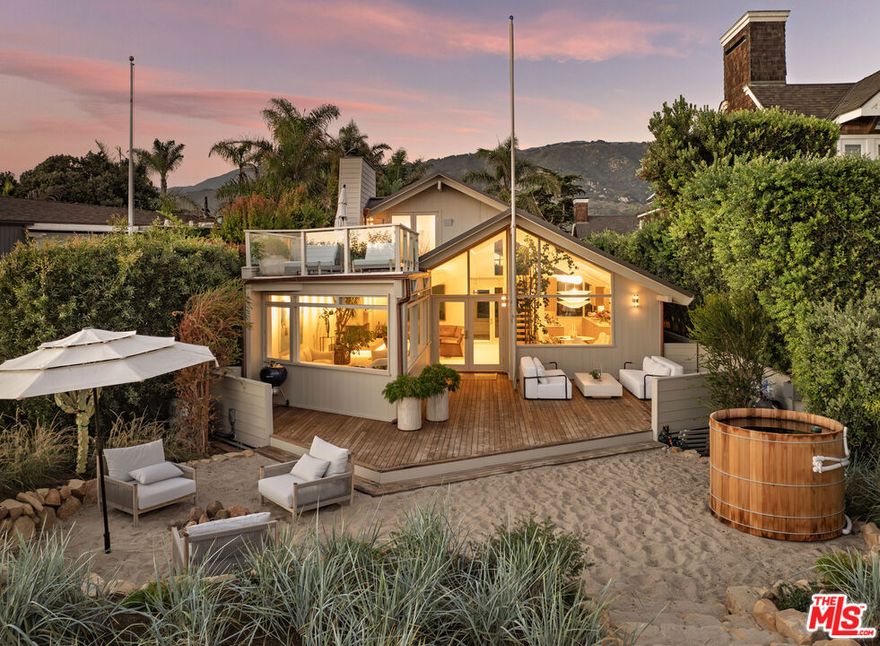 Kick your feet up at this magically reimagined Padaro Lane estate. Transformed from the ground up, this 5BD/4BA oceanfront retreat radiates modern elegance at every turn. Soaring sea-view windows, vaulted ceilings, & bespoke finishes define the main house, where airy interiors flow effortlessly btwn inviting entertaining spaces & intimate rooms for relaxation. The tranquil primary suite embodies coastal luxury w a private ocean-view deck & spa-like bath. The detached 2bd GH offers a peaceful escape, while outdoors, lush landsacping, multiple firepits, sitting areas, and a cedar hot tub create a private tropical haven. Located on one of CAs most prestigious stretches of sand, just moments from Montecito & Summerland, Padaro Lane is the destination you've been searching for.