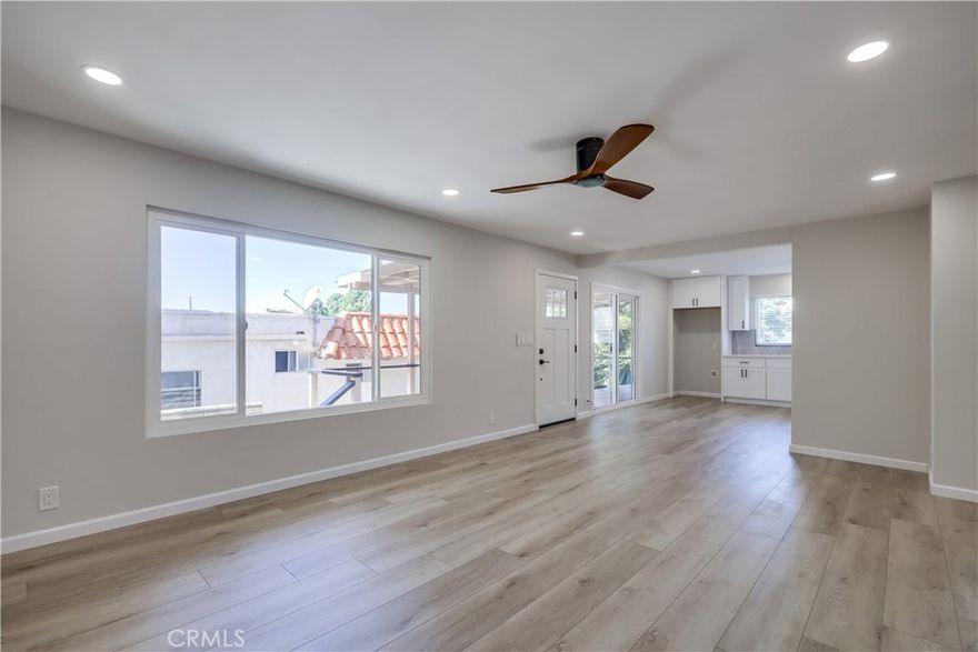 Superbly located in the heart of San Clemente a dream location offering the best of coastal living within walking distance of the beaches AND dining and shopping along N El Camino Real, this glistening unit was completely remodeled in 2023. Fine features and gorgeous amenities include sleek luxury vinyl plank flooring throughout, a neutral paint palette, upgraded ceiling fans, LED recessed lighting, updated vinyl windows and slider, updated window blinds, and fully remodeled Kitchen and baths. Prepare to fall in love when you step inside this light filled unit blessed with a spacious living area which is open to the gorgeous kitchen and dining area with direct access to sliders opening to the front deck creating an ideal indoor-outdoor living area, perfect for relaxing and gathering with friends and family. The sparkling kitchen is a dream come true with timeless white shaker cabinetry, upgraded hardware and faucet, beautiful Quartz countertops, matching stainless steel appliances, and a gorgeous custom tile backsplash. The full bath has been beautifully remodeled with dazzling tile floors, an elegant Quartz topped vanity, upgraded hardware and faucet, framed vanity mirror, stylish vanity lighting, gorgeous custom tiled shower surround, and upgraded shower fixtures and hardware. 2 spacious bedrooms with walk-in closets, 1 of those bedrooms also includes a private half bath with toilet and sink. The outside patio area is perfect for relaxing and BBQing with friends and family. Landlord pays for water and trash. This unit includes a 1 car garage space, plus 1 uncovered tandem parking space in the driveway. Convenient community laundry room is onsite.