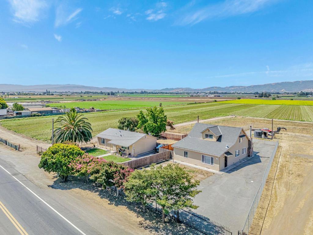 Rare opportunity to own 16.73 ± acres with two separate homes, ideal for multi-generational living, farming, or investment. Each home has its own entrance and fenced yard. The main home is approx. 2,100 sqft with 4 bedrooms and 2 baths (vacant; previously leased for $3,495/month). The second home is approx. 1,220 sqft with 2 bedrooms and 1 bath (currently leased at $2,642/month). The land is leasing at $850 per acre/year, and there is a shared agricultural & domestic well on the property. Enjoy peaceful rural living with strong income potential, just minutes from Gilroy Premium Outlets, Costco, Lowes, and Home Depot. Easy access to Hwy 101 and Hwy 152 only about 40 minutes to Silicon Valley!