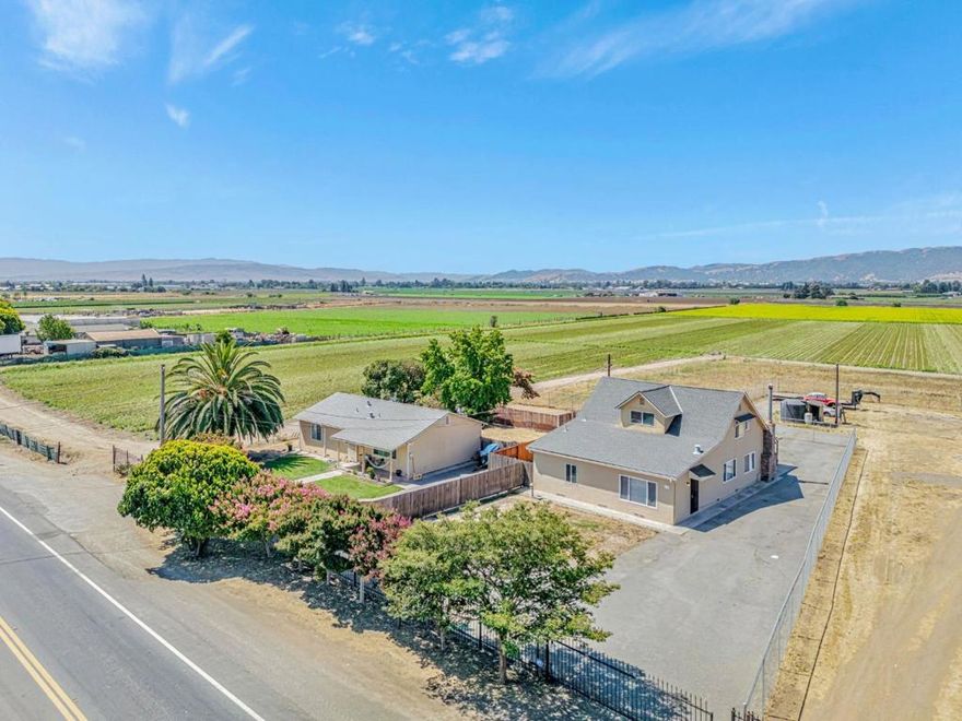 Rare opportunity to own 16.73 ± acres with two separate homes, ideal for multi-generational living, farming, or investment. Each home has its own entrance and fenced yard. The main home is approx. 2,100 sqft with 4 bedrooms and 2 baths (vacant; previously leased for $3,495/month). The second home is approx. 1,220 sqft with 2 bedrooms and 1 bath (currently leased at $2,642/month).  The land is leasing at $850 per acre/year, and there is a shared agricultural & domestic well on the property. Enjoy peaceful rural living with strong income potential, just minutes from Gilroy Premium Outlets, Costco, Lowes, and Home Depot. Easy access to Hwy 101 and Hwy 152 only about 40 minutes to Silicon Valley!