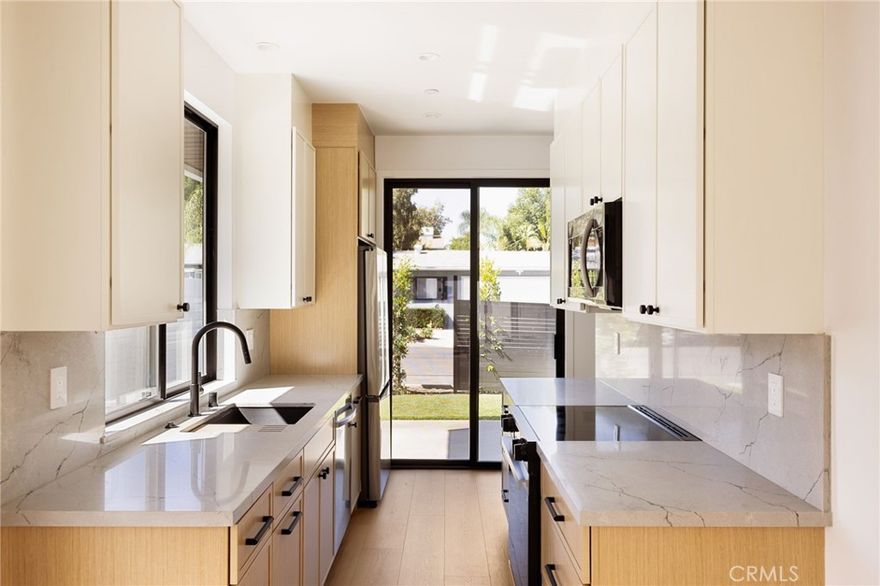 Introducing a luxurious, newly constructed 2-story ADU for lease in the highly sought-after Woodland Hills neighborhood, just north of Ventura Boulevard and adjacent to Walnut Acres. This stunning residence offers a perfect blend of modern elegance and everyday comfort, featuring soaring vaulted ceilings with exposed beams in the open-concept kitchen, dining, and family room area. The interior is adorned with wood-look laminate flooring, recessed lighting, and gorgeous contemporary finishes throughout. The thoughtfully designed layout includes abundant built-in storage, custom cabinetry in both the kitchen and bathrooms, and the convenience of in-unit laundry. The gourmet kitchen is equipped with brand-new stainless steel appliances—including a refrigerator, dishwasher, and oven—alongside sleek countertops and ample cabinet space. A sliding glass door leads to a private backyard oasis, ideal for relaxing or entertaining guests on the patio. This exceptional home offers the perfect blend of luxury and location, just moments from Westfield Mall & Village, Calabasas Commons, Warner Center, top rated shopping, dining, and entertainment to also include being close to the 101 freeway. Available now for immediate occupancy – a truly refined living experience awaits in one of Woodland Hills most sought after neighborhoods!