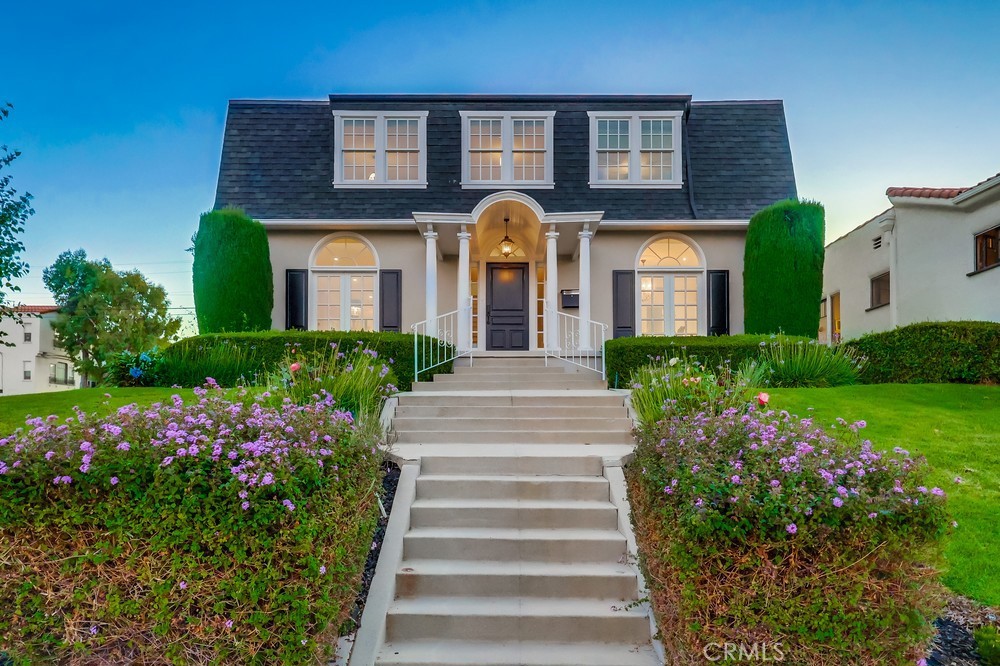 Some homes don’t just sit on a street—they define it. 1239 S. Patton Ave. is one of those rare San Pedro landmarks, the kind that turns heads every time you pass. Set high on a corner knoll in coveted Vista Del Oro, this Dutch Colonial masterpiece has graced the neighborhood since 1924, and it’s now ready for its next chapter. Lovingly maintained and thoughtfully upgraded over the past 38 years by its interior designer owner, this home blends period charm with timeless elegance. Step inside to find rich oak floors and a dramatic staircase that sets the tone. Sunlight pours into the expansive living room through large picture windows, while a stately stone fireplace flanked by original stained glass adds warmth and history. The formal dining room is equally impressive, with wainscoting, another set of stained-glass windows, a gorgeous crystal chandelier. and timeless wall sconces. The kitchen—both functional and beautiful—is fitted with custom cabinetry, honed black granite counters, marble floors, and high-end appliances, including a Sub-Zero refrigerator, WOLF six-burner range with pot filler, double oven, built-in microwave and a food prep area with a second sink. At the end of the hall on the main floor is a stunning three-quarter bath, appointed with Walker Zanger tile, a marble-topped vanity repurposed from fine furniture, and a new frameless glass shower enclosure. Upstairs, the central hallway is lit by antique fixtures from the original See’s Candy building in Los Angeles. Three spacious bedrooms offer charm and comfort, two with custom window seats and built-in storage. The vintage-inspired bath features original 1920s tub and tile, expertly restored and styled with care. Throughout the home, you'll find tall ceilings, custom window treatments, and artisan-made lighting that elevate every room. And that's not all! This San Pedro Classic comes with another charming 2 bedroom, 1 bath Craftsman bungalow sits on the lot with its own address. This added bonus provides $1780/month of rental income to help subsidize your housing expense. A 3-car garage off the alley offers potential for an ADU conversion that could provide additional income. Located just a few blocks away from the San Pedro treasure that is Averill Park and just a few more blocks away from the Weymouth Corners shopping plaza. This special property is more than just two homes on a lot. It makes a statement and is a legacy that could be in your family for generations to come. HURRY!