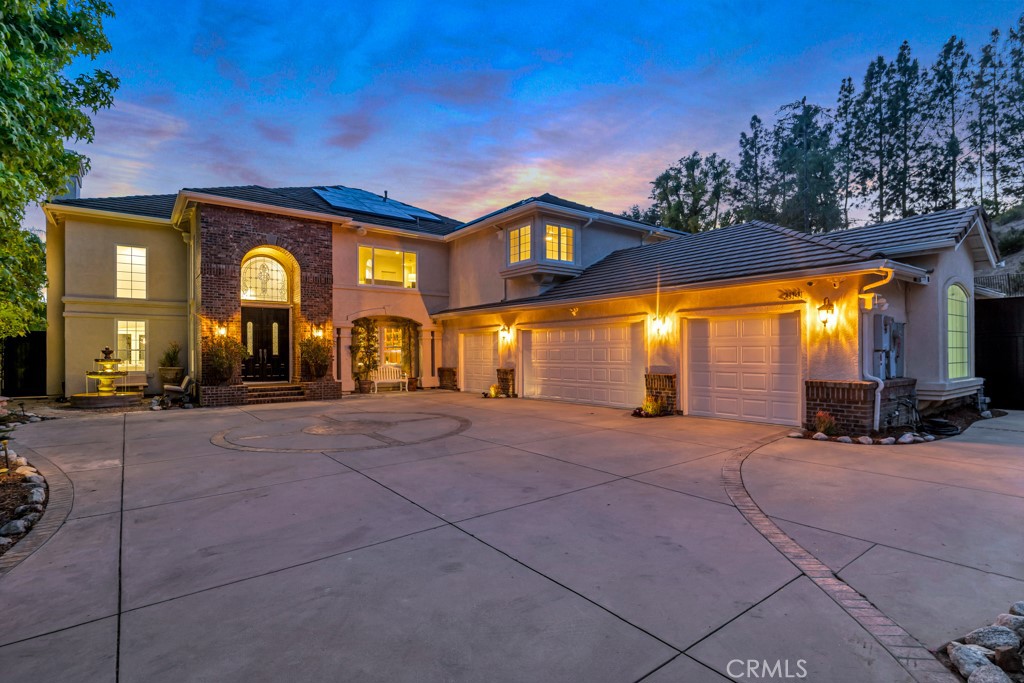 Ideally situated and perched high atop Topanga Canyon in the exceptionally prestigious and highly desirable Summit Pointe Estates, this forever home estate is perfect for entertaining guests and enjoying high-end, luxurious living. The seller meticulously designed and upgraded the entire property without regard to budget, using expensive finishes, great taste, and acute attention to detail. The interior showcases architectural splendor with a vibrant, modern flow, sophisticated lighting, six spacious bedrooms, six custom bathrooms, crisp and enticing lines, soaring living spaces, lofty cathedral ceilings, a dramatic wrought-iron staircase, a one-of-a-kind gourmet chef’s kitchen, an oversized formal dining room, a large movie theater, expansive family living areas, 4 car mechanics garage, solar system, and a whole-house water purification system. The master wing is simply exceptional, featuring an enchanting viewing deck with panoramic canyon views, his-and-hers grand walk-in closets, a massive covered outdoor patio, and a breathtaking, elegantly designed bathroom with a soaking tub. Abundant natural light cascades throughout the home, enhancing the two-story floor plan and offering seamless transitions from the exquisitely designed interior to the enchanting outdoor living spaces. Enjoy daily spectacular sunrises and cotton-candy sunset skies from numerous romantic outdoor sitting areas and the epic entertainer’s backyard, which includes Zen water features, lavish landscaping, outdoor sauna, dramatic fire pits, expansive turf lawn, oversized pool and spa, and the highest degree of privacy and exclusivity. Just minutes from world class beaches, famous hiking trails, the 101 freeway and all the amenities of Topanga Canyon this forever home could not be more conveniently located. Act fast—this one-of-a-kind estate truly has it all!