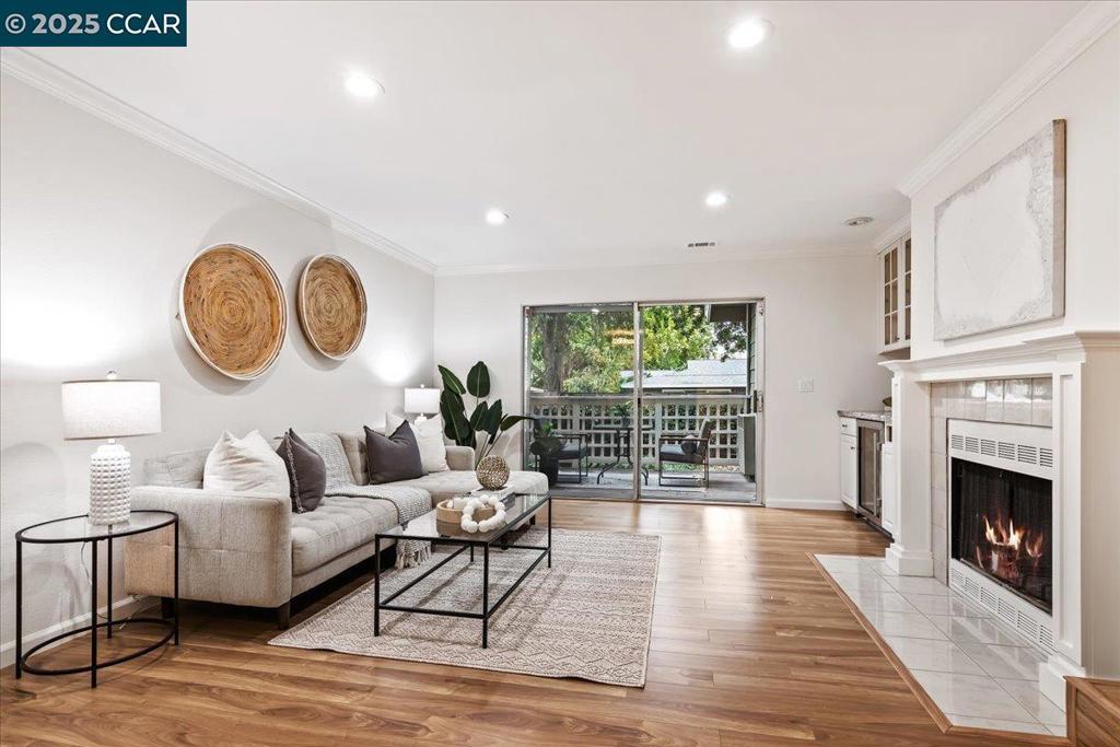 Welcome to this beautifully renovated, lower level condo offering modern updates and a prime Walnut Creek location. Step inside to an open floor plan that features a bright living and dining area with LVP flooring, a spacious half bath, and a cozy fireplace. The updated kitchen boasts brand new crisp white cabinetry, beautiful quartz countertops, and stainless-steel appliances. Sliding doors lead to a private patio, perfect for morning coffee or relaxing outdoors. Upstairs, you'll find that the spacious bedrooms are filled with natural light, brand new carpet and large closets with a lot of storage space. Each bedroom features their own en-suite bathroom. Both upstairs bathrooms have been updated with gorgeous vanities, bright light fixtures and new mirrors. New interior paint and fresh finishes throughout this unit complete the look and make it ready to move in. A stackable washer/dryer is included with this unit, making doing laundry easy and convenient. Community amenities include a sparkling pool, lush landscaped grounds, and covered parking. Enjoy close proximity to BART, downtown Walnut Creek shopping, local dining, public parks, beautiful hiking trails, and great schools for the ultimate blend of convenience and lifestyle. Come and see this turnkey home today!