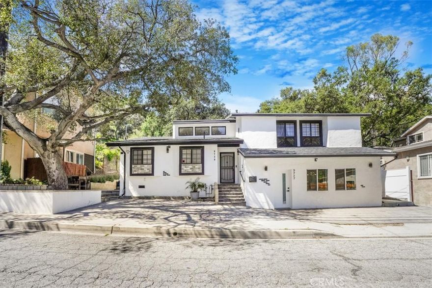 Split-level home + permitted 1-bed/1-bath ADU across three parcels (~14,170 sf combined). ~2,767 sf total living area offers flexible living: multi-gen, house-hack, or live-work. Light-filled main with open living/dining, generous kitchen, and indoor-outdoor flow; private bedrooms, updated baths, storage. ADU is ideal for rental income, extended family, or office/studio. Ample yard/drive/parcel depth for projects and play. Minutes to coffee, markets, parks, and trailheads; quick access to Foothill, 210, and studios. Equal Housing Opportunity. Info deemed reliable, not guaranteed; buyer to verify permits, square footage, parcel boundaries, and rent estimates.