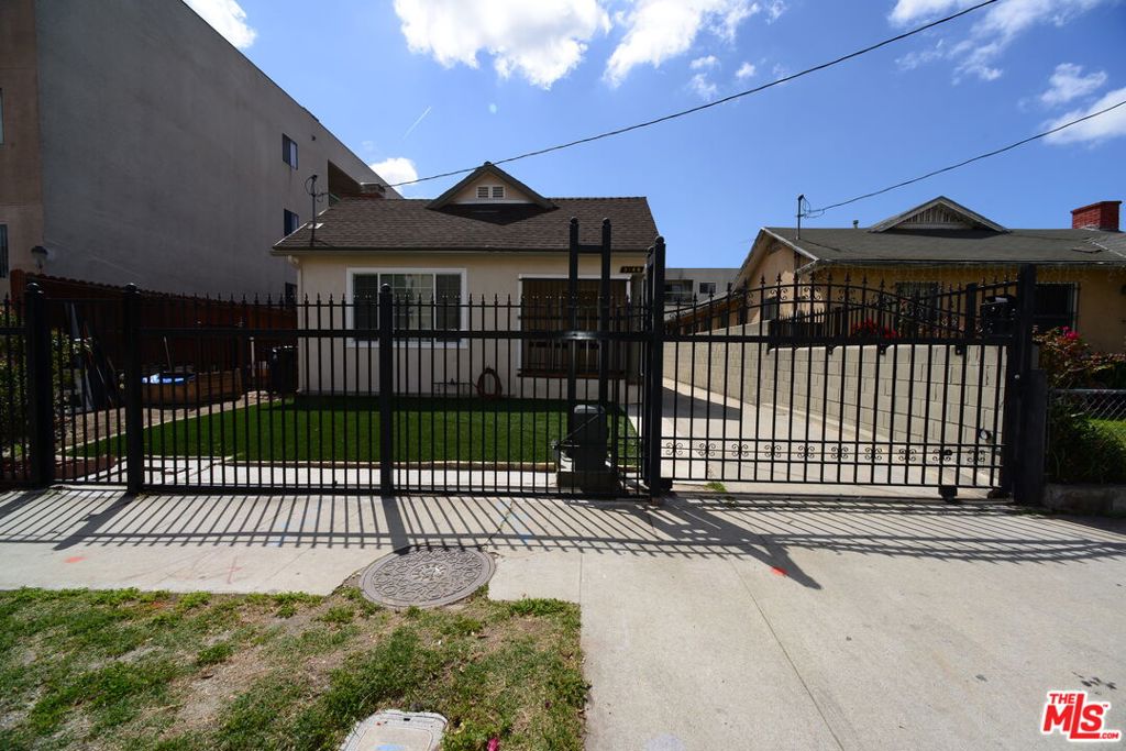 This single-story duplex, located in a prime Koreatown location, offers an excellent opportunity for both owner-occupants and investors. Within walking distance to popular Korean markets, restaurants, banks, and shopping, the property consists of two 2-bedroom, 1-bathroom units with a combined total of 1,679 sq. ft. Thoughtfully rebuilt from the ground up, it showcases real cherry wood flooring, recessed lighting, dual-pane windows, soaring ceilings, and elegant crown molding in every room. The kitchen has been tastefully updated with light wood cabinets, stainless steel appliances, and an in-unit laundry space, while the bathroom features a sleek glass-enclosed shower door. Outside, the gated property includes a security camera system, a spacious parking area with an automatic gate, and a low-maintenance backyard. Zoned R4, this property offers development potential for an apartment building. Don't miss this chance to own a versatile and income-generating property in the heart of Koreatown!