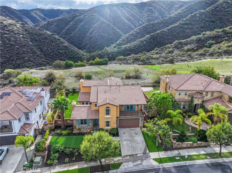 STUNNING VIEW HOME! When only the best will do! This home will rival some of the best model homes you've ever seen! Everything is NEW. New luxury vinyl plank flooring, new quartz countertops, new appliances, all 5 bathrooms and the kitchen re-done with quartz counter tops. Interior and exterior has just been repainted. This home has one of the biggest Master Bedrooms in the Retreat, with a private balcony off the Master with one of the best views in the Inland Empire! Large double walk-in Master closet.  All bedrooms have their own full bathrooms. Front balcony off large upstairs bonus/game room. Brand new Sparkling epoxy floors in the 4-car garage. Energy efficient with LED lights throughout and new artificial grass in the front yard. Located in the Inland Empire's premiere 24-hour, manned gated community -- The Retreat.