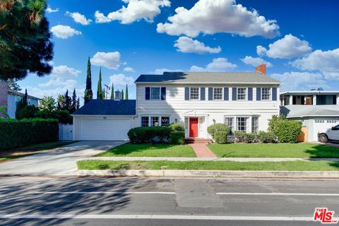 Photo of 4115 Degnan Boulevard, Los Angeles, CA 90008 (MLS # 25613193) Photo of 4115 Degnan Boulevard, Los Angeles, CA 90008 (MLS # 25613193)