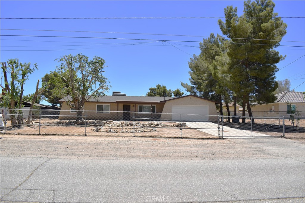 SPACIOUS HOME ON A LARGE LOT IN HESPERIA - BONUS ROOM & PRIME LOCATION! Discover this home, ideally situated near the college and close to shopping, hospitals, and with convenient freeway access for commuters. Boasting fresh interior and exterior paint, new carpet, and a brand-new stove (installed 12/10/2024), this property offers move-in-ready comfort. The newer roof (installed in 2022 or 2023) adds lasting value, while the large pool-sized lot provides a lot of space for all your outdoor toys. Inside, a versatile bonus room off the kitchen offers endless possibilities—convert it into a 4th bedroom, a game room, or a home office to suit your needs.