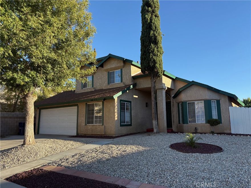 Welcome home! This spacious and well-maintained 4-bedroom, 2.5-bath house in Palmdale offers 1,692 square feet of comfortable living space. Built in 1987, the home features fresh paint throughout and a functional layout. 
One of the four bedrooms is conveniently located downstairs — ideal for guests, extended family, or a home office. The open living and dining areas provide plenty of room for relaxing and entertaining. The kitchen includes ample storage and natural light.
Enjoy easy parking and extra storage with the attached 2-car garage. The eco-friendly front yard is landscaped for someone who is looking for simple care. Located in a quiet Palmdale neighborhood, close to schools, shopping, and commuter routes.
Section 8 is gladly accepted, and the home is move-in ready!