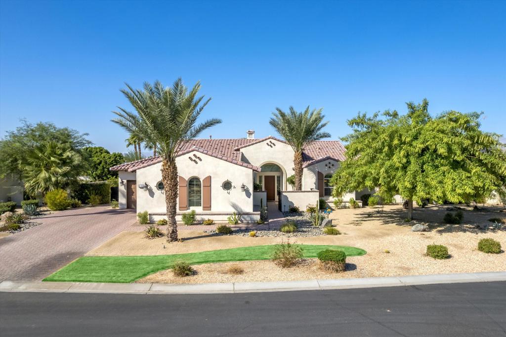 Located within the exclusive gated community of Stonefield Estates--home to just 25 estate properties--this stunning 3,405 sq. ft. residence offers bright, open living spaces with sophisticated contemporary finishes.Upon entry, you're welcomed into a spacious great room featuring soaring ceilings with exposed real wood beams, a cozy fireplace, and built-in surround sound--perfect for relaxing or entertaining.The gourmet kitchen is a chef's dream, showcasing abundant maple cabinetry, Caesarstone countertops, a large walk-in pantry, generous dining area, and an oversized island. The premium appliance package includes a Sub-Zero refrigerator, Wolf range with double ovens and vent hood, and an Asko dishwasher.The expansive Primary Suite is a true retreat, highlighted by coffered ceilings, crown molding, and a spa-inspired bathroom with dual vanities, a soaking tub, makeup vanity, and an enormous walk-in closet with custom built-ins.A spacious Junior Primary Suite is privately located on the opposite wing of the home, featuring its own luxurious bath with dual vanities and a walk-in closet. The third ensuite bedroom also includes a walk-in closet and private bathroom.Step outside to your private 1/2-acre resort-style backyard, complete with a saltwater Pebble Tec pool, raised spa with waterfall feature, covered patio, built-in BBQ, custom lighting, and plenty of space to entertain.Additional features include:Versatile flex space (currently used as a formal dining area)Porcelain tile flooring throughoutSoft water systemPlantation shutters3-car garage with epoxy flooringAll located just minutes from the Empire Polo Grounds--home to the world-renowned Coachella and Stagecoach music festivals.Call today to schedule your private showing!