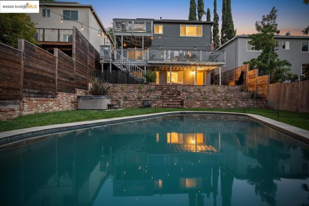 Private Redwood Heights retreat in a superb location. Enjoy the best this sought-after neighborhood has to offer: amazing micro-climate; families enjoying Avenue Terrace Park; dog walkers & bicyclists galore; minutes to 13 & 580; nearby Redwood Regional Park; close to shopping & Montclair's iconic village vibe. This wonderful, updated home has many smart improvements including: updated kitchen (newer kitchen appliances, cabinets and counters, heath tile backsplash); updated bathrooms (rain shower heads, modern tile, soaking tub, bidet); ensuite primary bedroom with large dressing room and amazing, walk-in shower; electrical upgrade to 200 Amps; new hot water heater; newer roof. Enjoy the privacy, greenery, and peaceful outdoors from either of 2 large decks overlooking the backyard & your own swimming pool (recently rebuilt with a new pump and maintained weekly) surrounded by freshly installed sod, and a perfectly situated hot tub. New technology and ecological features include: owned solar system, Nest thermostat; CCS and NACS EV chargers; newer forced air HVAC system; dual pane windows; recessed LED lights throughout and designer dining room light fixture; energy efficient washer and dryer; drip irrigation; drought tolerant landscaping. Don’t miss this fantastic opportunity!