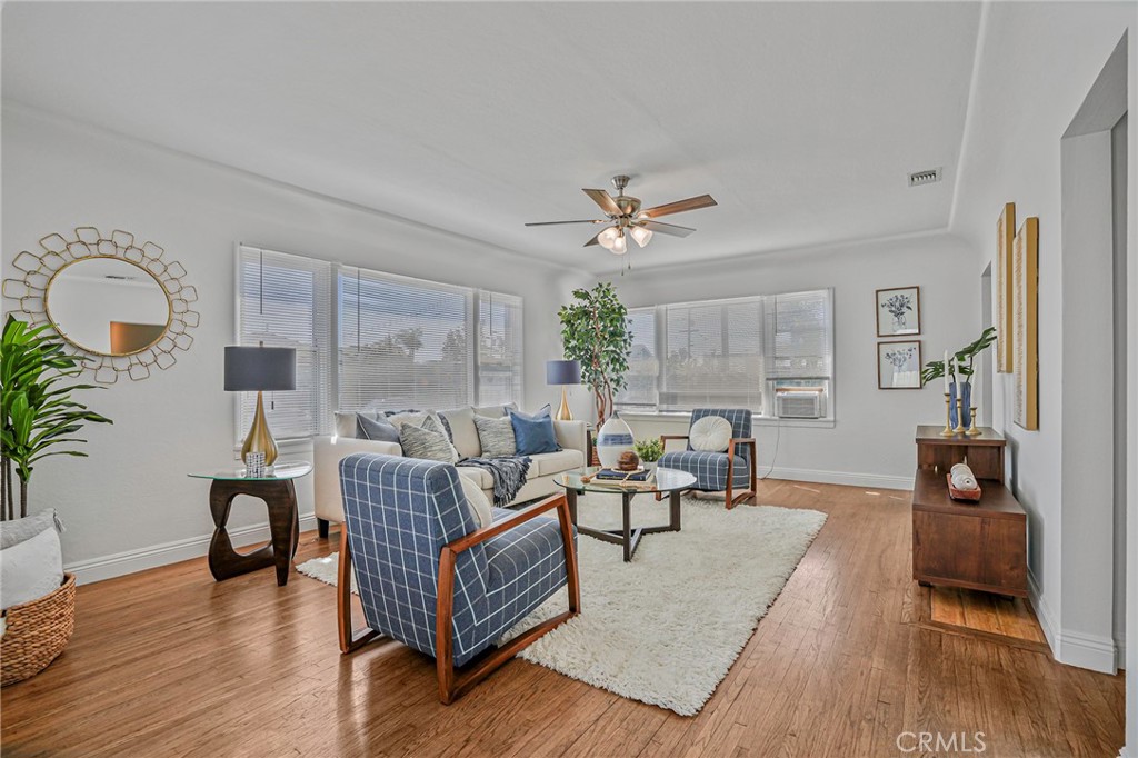 This sun-drenched, 3 bedroom, 1.5 bath home is in an lovely R2 zone of San Pedro. Are you creative and looking for the perfect home to update with your style? If so, you are looking in the right place! The front yard is fenced and there is a nice courtyard patio and garden beds welcoming you to the home. Inside you will find a very comfortable living room with large windows and mostly original hardwood floors. The spacious kitchen has plenty of room for several cooks and the adjacent dining room can host a large group of friends for dinner! The main bedroom is comfortable and has the added benefit of a half bathroom. The backyard is a large stamped concrete patio which is perfect for summer BBQs. The laundry room is located off the back yard and attached to the garage. There are 2, two car garages which are detached from the home and have alley access. Check with the city to see if you could convert them to additional units or an ADU! Recently updated features include a new GE refrigerator and gas stove, new mini-blinds throughout the home, new interior and exterior paint, new lighting fixtures in the kitchen and dining room, and a new ceiling fan in the living room. Don't miss this gem!