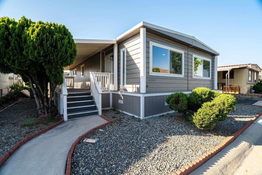 LOVELY REMODELED HOME COMPLETE WITH FENCING. OFFERED FOR $269,000. This must-see home sits in a Senior Community for ages 55 and above. Mission Village has many amenities including a heated pool and Jacuzzi, a gym, a laundry room, and a clubhouse for social gatherings. This home has been given a complete make over including a new roof, a new water heater, new decking for the porch, new white vinyl fencing, new washer and dryer, new kitchen appliances, new cabinets for both the kitchen and baths, new vinyl laminate flooring all throughout the home, plus more. It is in a great location, just across the street from the clubhouse. The monthly space rent here is 1,350.00. If you are looking for a nice relaxing Senior home that is move in ready, you do not need to look any further. This home is for you!!