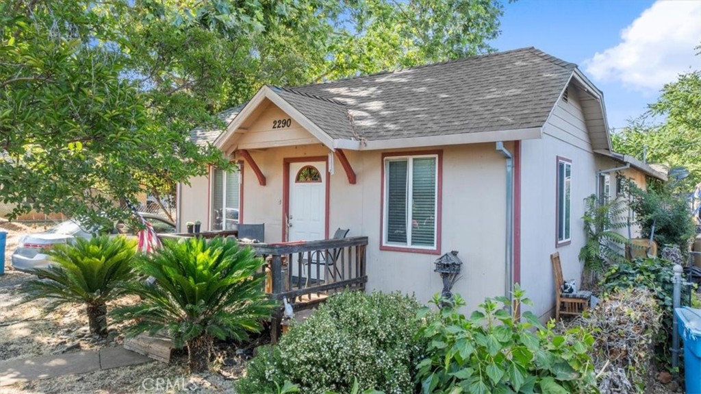 Welcome to this charming cottage style 3-bedroom, 2-bathroom home offering over 1,300 sq ft of comfortable living space on a manageable 0.11-acre lot. Thoughtfully designed with an open floor plan, this home features a spacious kitchen with a breakfast bar that flows seamlessly into the dining and living areas—perfect for everyday living and entertaining. Enjoy the comfort of central heating and air and take in the beauty of mature shade trees that enhance both curb appeal and outdoor enjoyment. Outside you'll find a covered back patio, ideal for relaxing, grilling, or hosting guests year-round. The detached garage offers added convenience and storage, completing the package for this move-in ready home.