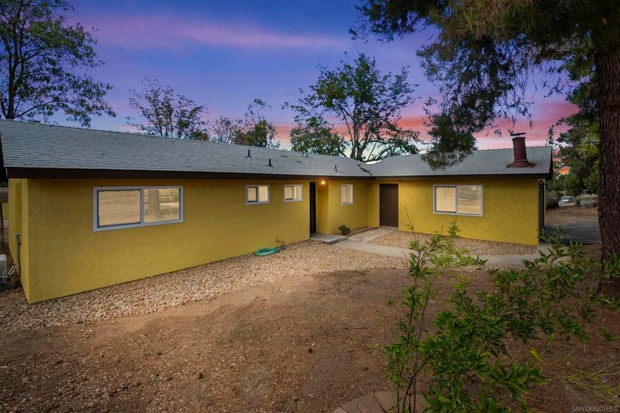 Charming Single-Story Ranch Home in the Heart of Ramona Offered at $805,000 | 3 Bedrooms | 2 Baths | Approx. 1,600 Sq Ft | 0.5 Acre Lot Welcome to 1121 11th Street — a beautifully updated single-story ranch home offering a perfect blend of comfort, function, and country charm. Nestled on a spacious half-acre lot in the heart of Ramona, this property provides plenty of room to breathe, entertain, and enjoy the laid-back lifestyle this community is known for. Step inside to find a warm, inviting interior featuring laminate flooring, a bright open-concept living area, and a thoughtfully designed floor plan that maximizes every inch of space. The updated kitchen includes a range/oven and refrigerator, opening seamlessly into the dining and living areas—ideal for gatherings or quiet evenings at home. This property features three comfortable bedrooms and two baths, and a large converted garage bonus room that is approx 400 sq ft. Modern updates, zoned air conditioning, and forced-air electric heat ensure year-round comfort. Outside, the possibilities are endless. Enjoy your morning coffee or evening sunsets on the deck overlooking the gently sloping landscape, surrounded by cross fencing and mature trees. The driveway accommodates multiple vehicles, with ample space for RV parking and even a barn or outbuilding—perfect for animals, hobbies, or additional storage.