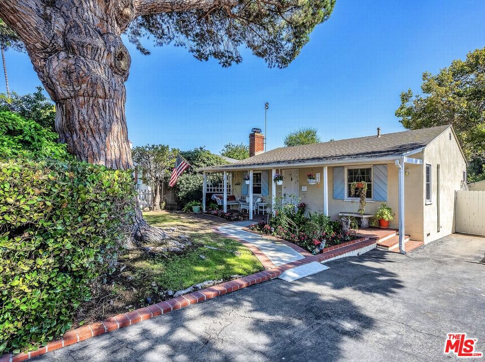On the market for the first time since 1966, this charming 2BR/1BA coastal cottage sits on a 5,554 sq. ft. lot with a detached studio ideal for an office or creative space. The backyard features mature citrus trees and plenty of room to relax or expand. This home offers flexibility to live in as-is, remodel, or build new. Located on one of the most sought-after streets in Westside Village and within the desirable Clover Avenue Elementary School district. Properties on this block rarely become available. Don't miss this rare chance to secure a timeless Westside Village gem with endless potential.