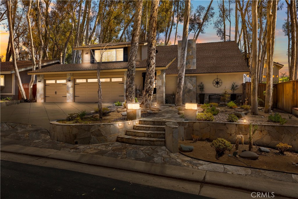 Stunning and thoughtfully remodeled home offers a perfect blend of modern amenities and versatile living spaces. Immediately the picturesque curb appeal, iron glass-inlay double front door, extra large driveway and 3-car garage sets the stage for what's to come. The home's entrance into the formal living and dining room boasts a 2-story vaulted ceiling, modern upgraded stair rail, a warm natural glow that is reminiscent of golden hour and a cute outdoor boho nook. Continuing to the remodeled and timeless kitchen that's open to a dinette area and family room which all frames the outdoors with floor to ceiling windows and doors. The custom wet bar, ample kitchen counter space and open floorplan make this home ideal for creating memories with gathered family and friends or quiet nights keeping everything close at hand. The downstairs bedroom and full bath completes the downstairs before heading out back to where you'll find an entertainers oasis. Boasting areas to play, dine and even wine...in the jacuzzi. Upstairs are 4 additional bedrooms. 2 bedrooms were combined to make a media/flex room and could easily be converted back. The primary suite has a custom walk-in closet to display clothes, shoes and purses to be easily accessible. The home has over $125,000 in upgrades. Additional items include dual pane windows and doors, tankless water heater, designer lighting, flooring, HVAC, electric in the garage for an EV and low maintenance landscaping. Additionally, the highly rated elementary is a STEAM Magnet school and is walkable. As well the middle school and high school are an easy walk. This home also comes with membership to the exclusive Beach & Tennis club. Here you'll have access to a Jr. Olympic pool, a smaller pool and areas perfect for children including the recently improved beach lagoon. Enjoy any of the 5 tennis courts or try your skill on the pickleball court. The club also provides a fitness center with classes. There's a sand volleyball court as well as basketball. There's also a preschool here. The club promotes regular events to create community among its members. This is more than a home. It's your private retreat and community dream. Welcome to your forever scene.