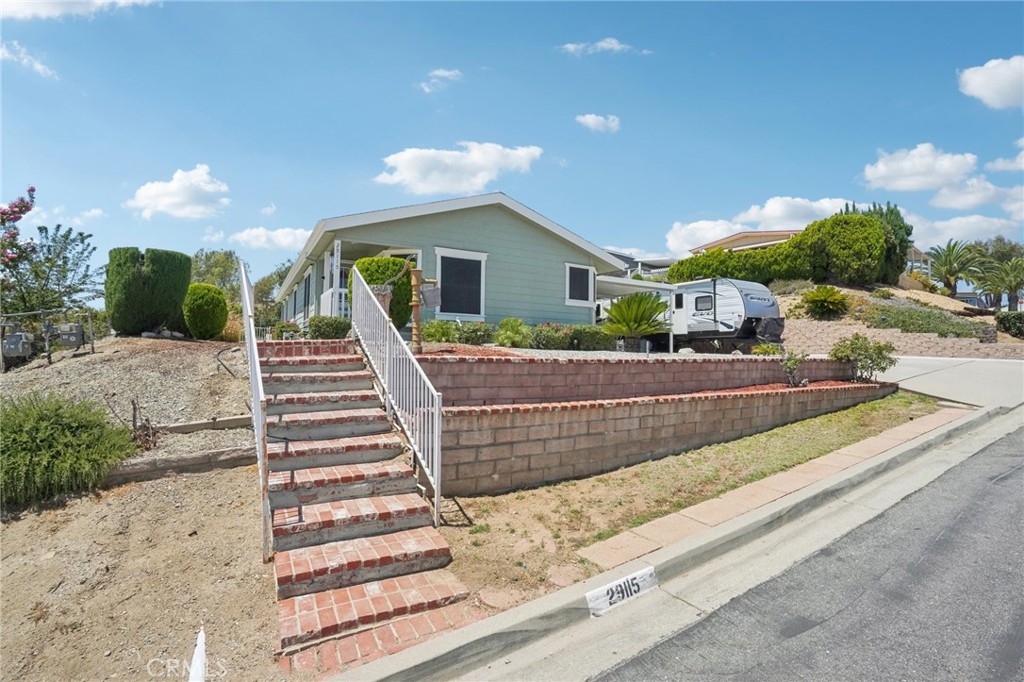 Charming 3-Bed, 2-Bath on 1/3 Acre Lot with Permanent Foundation and low HOA fees in a 55+ community! This inviting home features warm wood flooring in the main living areas and abundant natural light throughout. Bedrooms are carpeted for comfort, with the primary suite offering a private ensuite bath and sliding glass doors to the backyard. The expansive lot provides ample space to design your dream outdoor oasis, while the existing concrete patio is perfect for creating an alfresco dining area. Additional highlights include a 2-car garage, RV parking in the driveway, and a welcoming community with HOA amenities such as a pool, spa, meeting room, and more. Don’t wait—book your tour today!