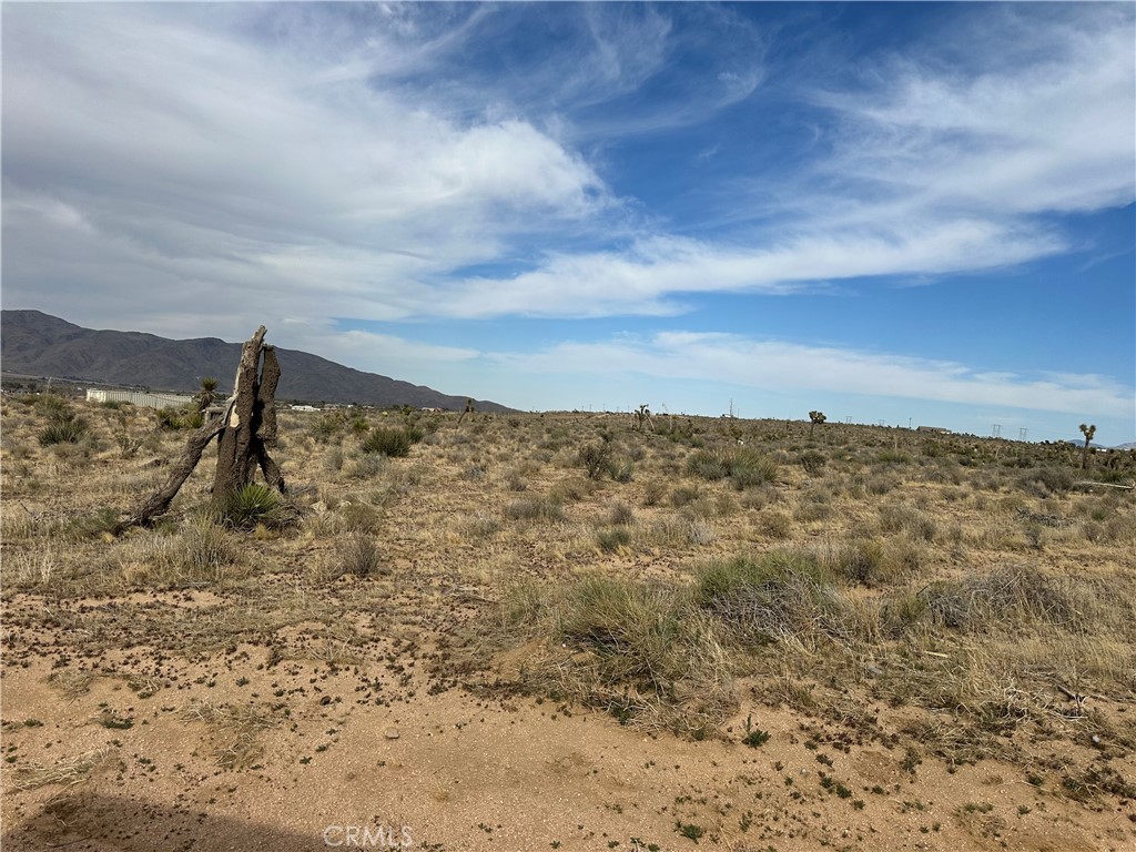 Ready to build your dream home in Apple Valley on 5 acres with a beautiful view? Located in southeast Apple Valley, this parcel captures the spirit of the high desert—big skies, sweeping view, and peaceful solitude. The sunrise and sunset views in the Desert are simply breathtaking. This land is the perfect canvas for a custom home, ranch, recreational retreat, or future development in a growing high desert community. Utilities close by!