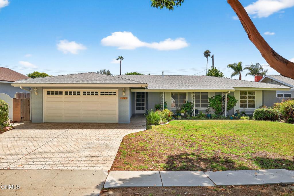 Welcome home! This beautifully maintained 4-bedroom, 2-bathroom home sits on a quiet, tree-lined street in one of Ventura's most charming neighborhoods below the college. Offering 1,561 square feet of living space plus an additional 140 square foot bright and airy sunroom, the home is perfect for comfortable everyday living and entertaining. The open and inviting layout includes spacious kitchen with breakfast bar, cozy living room with fireplace, dining area, and luxury vinyl plank floors installed throughout in 2025, complementing the home's fresh interior paint and incredible natural light streaming in from the three skylights in kitchen, family room and hallway bath. The spacious primary bedroom features shutters, two large closets, and an updated en suite bathroom with vanity area. Enjoy the private backyard oasis with mature citrus trees, sprawling lawn area, and covered patio, perfect for play or basking in the SoCal sunshine! Additional upgrades include a newer 200-amp electrical panel (2023), roof (2024), main sewer line (2024), exterior paint (2025), hot water circulating pump (2025), and more! Centrally located in the heart of Ventura. This is a rare opportunity to own a truly special, move-in-ready home in a fantastic neighborhood!