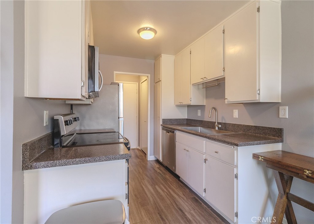Welcome to this beautifully located 1 bed, 1 bath condo in the highly desirable Rossmoor Park gated community of Seal Beach. Offering 729 square feet of comfortable living space, this top-floor unit ensures added privacy with no neighbors above and overlooks the pool, spa, gym, and clubhouse—giving you a true resort-style living experience. The open floor plan creates a spacious and inviting atmosphere, perfect for relaxing or entertaining. Enjoy added convenience with private storage in your assigned carport, ideal for beach gear, bikes, or seasonal items. Located just 5 miles from the Seal Beach Pier, you’re minutes away from coastal breezes, charming shops, and dining options. Rossmoor Park is a secure, well-maintained community with lush grounds and easy access to freeways, shopping, and top-rated schools. Whether you're a first-time buyer, investor, or looking to downsize, this home offers the perfect blend of location, lifestyle, and value.