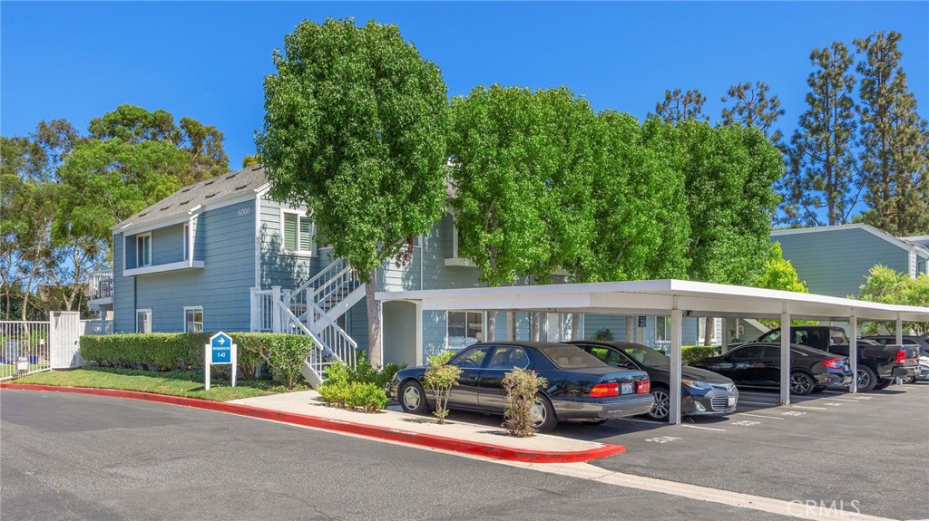 Experience the charm of this beautifully redesigned 2-bedroom, 2-bathroom ground-level, end-unit condo nestled in the gated Village on the Green community of Bixby Village. Recently redesigned by Baytown Design, this residence welcomes you with a harmonious blend of subtle retro design elements and a modern coastal flair, creating not only a lovely living space but one that truly inspires. The open living room and dining area overlook a private patio, perfect for unwinding after a long day or enjoying the weekend outdoors. Through the sliding door, you see the patio encircled by lush greenery, offering a serene space to rest and relax. The kitchen features rich complementary tones with custom cabinetry doors in Pashmina with soft-close hinges, brand-new GE, LG, and Samsung appliances, champagne bronze pulls and knobs, as well as a black hexagon-tiled floor, creating a striking focal point. Each bedroom features an expansive walk-in closet and a remodeled bathroom, including exquisite new vanities, mirrors, faucets, fixtures, and flooring, adding a touch of sophistication to every detail. All lighting fixtures have been upgraded to cast a warm, inviting glow throughout the home with a touch of style working in nicely with the freshly painted walls, ceiling, and baseboards. This is one of the few residences in this community that has an indoor laundry niche, featuring a brand new stackable GE washer and dryer. This residence comes with two assigned parking spaces – one carport and one uncovered space. This community offers exclusive resort-style amenities, including a sparkling pool, relaxing spa, and outdoor barbecue and picnic areas. Residents enjoy access to a clubhouse with a billiard room, a multipurpose room equipped with a full kitchen and wet bar, as well as a state-of-the-art fitness center. Adjacent to the community is the nine-hole Bixby Village Golf Course.