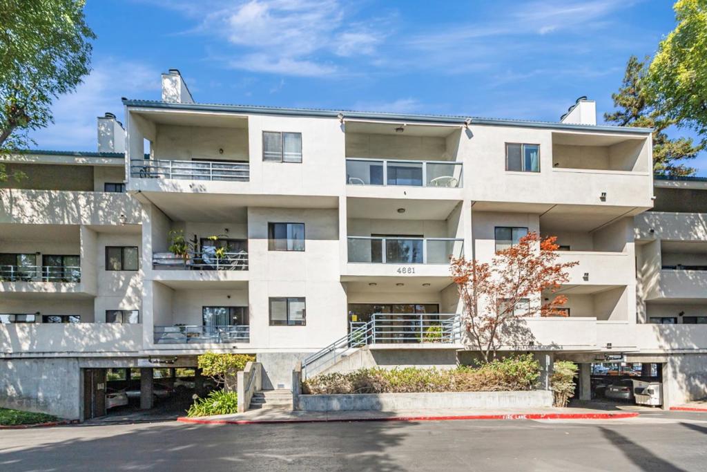 This beautifully maintained 1-bedroom, 1-bath residence offers 813 sq. ft. of well-designed living space with modern upgrades and everyday convenience. Located in the desirable gated community of The Plaza, the home enjoys a secure setting with landscaped courtyards, mature trees, and a charming central fountain. Located on the 2nd level with rare elevator access from the underground garage, the unit features a spacious living and dining area with a cozy wood-burning fireplace that opens to a private balcony. The updated kitchen is paired with an adjacent dining area for daily ease, while the upgraded bathroom includes modern finishes. The generously sized bedroom offers a large walk-in closet, ample storage, and direct balcony access. Fresh interior paint and in-unit laundry add to the appeal. Community amenities include fitness center, pool/spa, and plentiful guest parking in addition to one assigned underground space. Centrally located near major tech employers including Apple, Santana Row shopping, dining, and commute routes with quick access to Hwy 280, 85, 880, Lawrence and San Thomas Expressway. Top- rated Cupertino schools, this home blends comfort, convenience, and an outstanding location in the heart of Silicon Valley. Open House: 9/27-28, Sat & Sun, 1:30-4:30 PM