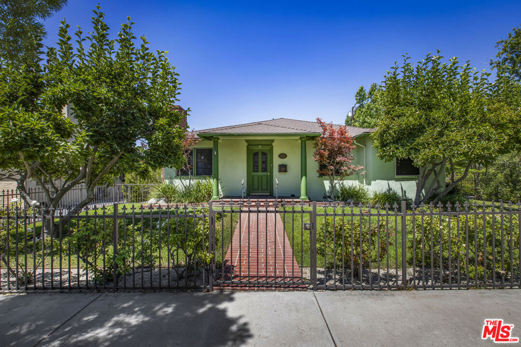 Welcome to this single level charmer in Pasadena, located near CalTech, San Marino and all the area has to offer. Perched on a peaceful corner lot, you will enjoy added privacy and lush curb appeal with a gated front yard. Inside, you'll discover bright natural light, rich character and warm details throughout, including hardwood floors and a traditional cozy brick fireplace that invites you to unwind and enjoy quiet evenings. With a thoughtful layout, this home features three well-appointed bedrooms and two bathrooms. Step outside to find a beautiful pergola, ideal for outdoor dining and entertaining. The property is lined with mature fruit trees including lemons, plums and oranges, adding natural beauty and offering fresh, tasty fruit right from your own yard. The grassy outdoor area is perfect for outdoor activities, gardening, or simply soaking up the sun! Well-maintained and filled with character, this home is waiting for its next loving owner. Don't miss this opportunity to make this Sweet House your Home!
