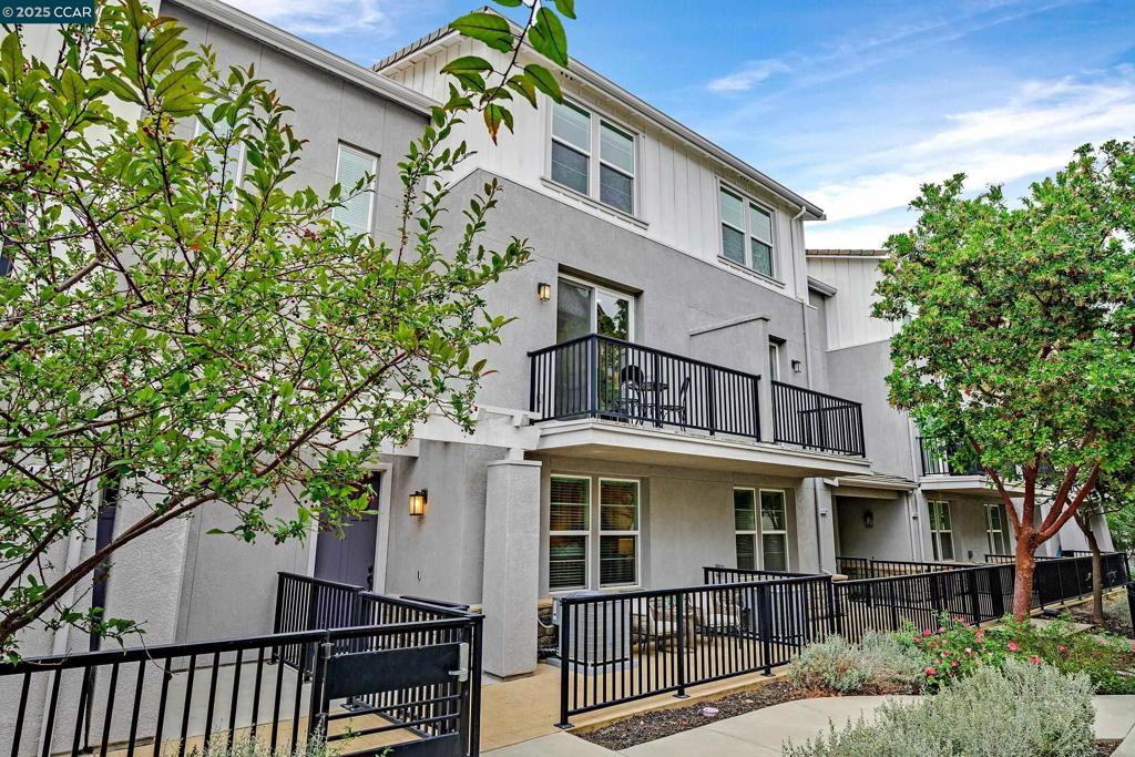 This stylish, NORTH facing, move-in-ready townhouse-style condo offers 4 bedrooms and 4 full baths, including three en suite bedrooms for ultimate comfort and privacy. The versatile layout is perfect for multi-generational living, guests, or a dedicated home office.The first floor features a private bedroom and full bath with walk-in closet—ideal for visitors or remote work. On the second floor, you’ll find an inviting open-concept living space with wood flooring, a bright living and dining area with balcony and a Chef's Dream kitchen equipped with a gas stove, stainless steel appliances, upgraded cabinetry and a spacious island. On this level is also a bed/office, full bath, and laundry room. The third floor has a generous primary suite with walk-in closet, dual vanities, and shower plus an additional bedroom en suite. The third floor hosts a generous primary suite with a walk-in closet, dual vanities, and a walk-in shower, plus an additional bedroom en suite. Located just .2 miles from Cottonwood Creek School, little over a mile to Emerald Glen High School, and close to Fallon Sports Park, shopping, dining, freeway access, and major employers, this home blends convenience with modern comfort. A perfect blend of style, versatility, and location! Offers reviewed on Fri 9/19, 11AM