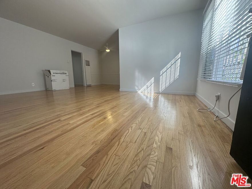 Spacious, peaceful, charming and traditional, 1-bedroom, 1-bathroom unit is perfect for anyone looking to experience the vibrant lifestyle of Los Angeles. Located just a few blocks from W. 3rd St, you'll be in the heart of one of LA's most trendy and exciting neighborhoods. As you step inside, you'll immediately appreciate the unit's spacious, warm and welcoming atmosphere with a lot of light. The living room features hardwood floors and large windows that let in plenty of natural light. The kitchen is equipped with appliances and pantry. The bathroom features a shower/tub combo and is conveniently located next to the  bedroom. Whether you're a young professional or a small family, this unit is the perfect place to call home. The unit comes with 1 assigned parking spot. The building has onsite laundry facility.  Don't miss out on this great opportunity to experience LA living at its finest!