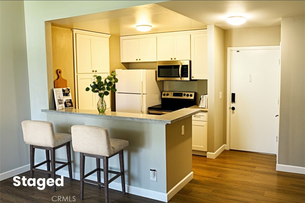 This condo offers a cozy living space with modern amenities tucked away in one of the most desirable corners of the gated Mariner’s Park Village community. With no neighbors above or below, this 1-bedroom, 1-bath condo offers the rare combination of serenity, security, and style. You’re welcomed by a sense of openness by a high vaulted ceiling. The spacious living area leads to a charming private balcony. The kitchen is well-sized and functional. Additional features include gated community, laundry room right downstairs, location is shielded from freeway noise, ocean breeze, assigned carport parking space. Community amenities are Beautifully maintained park-like grounds, two swimming pools, clubhouse, playground. Invest in comfort, style, and a place to call your own in a great city!