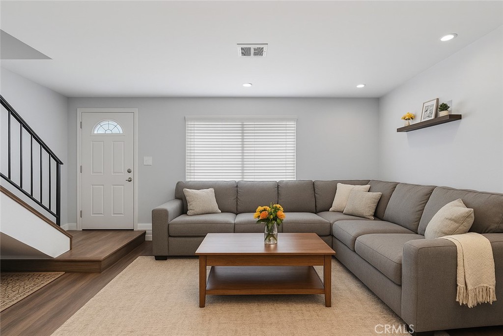 Beautiful Corner Townhome with Scenic Views in Santa Clarita! Don’t miss this exceptional opportunity to own a corner unit nestled next to a tranquil greenbelt, this upgraded townhome offers both privacy and picturesque views. Step inside to discover stylish upgrades throughout, including updated flooring, energy-efficient windows, a newer sliding glass door and recessed lighting that brightens every space. The first floor features a cozy family room with fireplace, kitchen, dining room & convenient guest powder room. Upstairs you’ll find a double-primary bedroom layout—each bedroom is generously sized, complete with ceiling fans and walk-in closets, sharing a bathroom with updated shower enclosure. Entertain with ease in your private courtyard—perfect for summer BBQs and outdoor relaxation. Additional highlights include a private one-car garage, an extra carport, and built-in storage for added convenience. The community offers fantastic amenities, pool, playground, basketball court and is located near award-winning schools, scenic parks, and all the best that Santa Clarita has to offer.
