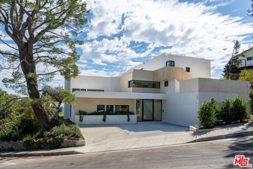This sophisticated light-filled modern contemporary 3 level home features ultimate seclusion in the prestigious hills of Brentwood. The uniquely designed 4 bedroom/6 bath home offers not only complete privacy on a large 14,370 sq ft lot, but also sweeping views throughout the interior spaces and outdoor decks. With modern interiors perfect for entertaining, open concept living area with soaring ceilings and large picture windows. Listing available for 13+ months.