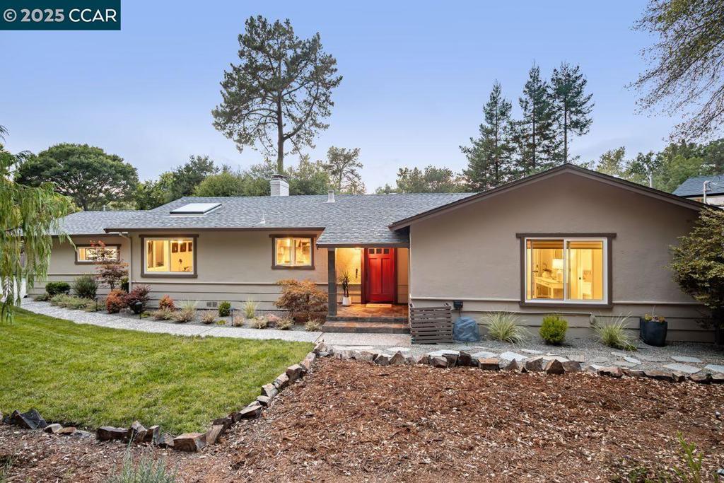 Tranquility Among the Redwoods. This home, nestled behind a grove of mature redwoods, commands great curb appeal on a quiet street close to the heart of Orinda. The back yard is as alluring as the front, with a spacious, fenced wood deck, two pergolas, a spa, putting green, play area, and manicured landscaping. Inside, the home offers three bedrooms and two bathrooms (including an en-suite bath in the principal suite), each with contemporary fixtures. All bedrooms have garden views. The well-appointed kitchen has granite counters, Indusparquet Brazilian cherry engineered hardwoods, Dacor and other top appliances, and a wine refrigerator. The dining room and family room sit adjacent, with a fireplace and outside deck access through sliders. Skylights offer natural lighting in the kitchen area and principal suite. Parking is easy in the two-car garage (with built-in cabinetry) or on the driveway or street. The home is well shielded from freeway traffic and noise, and yet Highway 24 access toward San Francisco or Walnut Creek in either direction is just two minutes away.