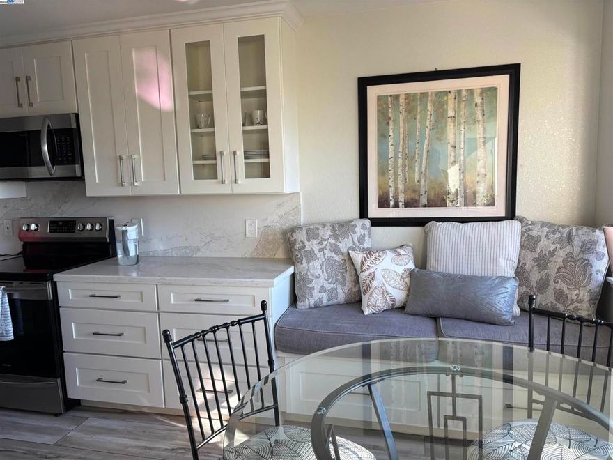 No steps to front door.  Bathed in natural light and crafted with timeless sophistication, this custom-designed condo offers a perfect balance of beauty and comfort. Completely reimagined in 2017–2018, every inch reflects thoughtful design and expert craftsmanship — from the bespoke built-ins to recessed lights throughout to the seamless flow of open, airy spaces.  Expansive windows frame sweeping views that become a private front-row seat to sunsets and the city’s most dazzling moments — where, on the Fourth of July, fireworks illuminate the skyline in a brilliant display of color and light.  This is more than a home — it’s an experience of luxury, serenity, and style, where every detail invites you to linger a little longer.  HOA covers water and trash