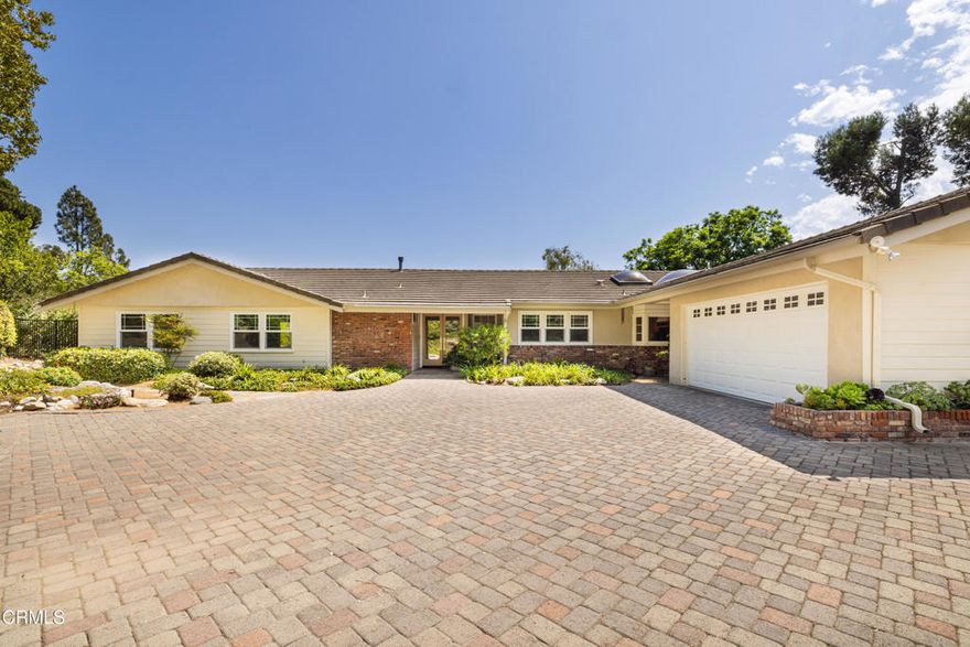First-time on the market in 48 years!  This classic ranch-style home in the Las Posas Estates has so much personality and sits on over an acre of land!  With its long, spacious, flag-lot driveway, this three bedroom, three bathroom home has been lovingly cared for by the same family since 1977.  As you walk inside the home, the traditional ranch style paver tiles will immediately catch your eye along with  the comfortable single story floorplan.  Off the foyer is the user-friendly kitchen and attached breakfast nook which leads into the cozy den with brick fireplace.  The living room and dining room areas look out over the mature backyard with lots of space and canyon views.  Down the opposite hallway are two bedrooms, the hallway bathroom, and then the primary suite with views galore!  This property is located close to Las Posas Country Club and Sterling HIlls Golf Course as well as everything that Camarillo and Ventura County has to offer!